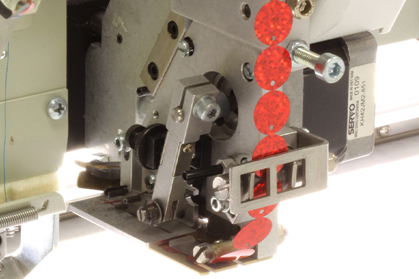 Sequin embroidery stitched on a ZSK machine using a sequin device